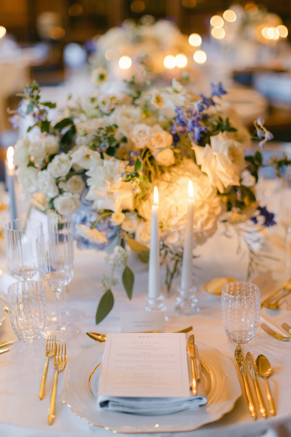DESTINATION WEDDING PLANNER - GALLERY IMAGES - Blue and white floral centrepiece with white and gold place setting